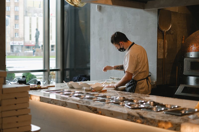 Punch pizza founders crafting artisan pizza dough in the kitchen